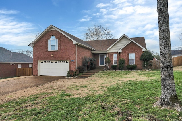 front facade featuring a front yard and a garage