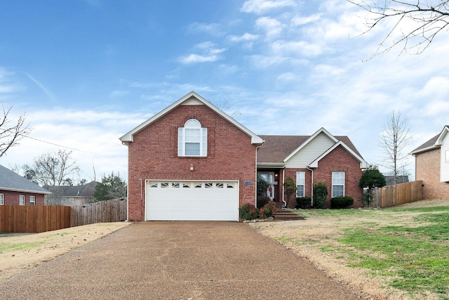 front of property featuring a front yard and a garage