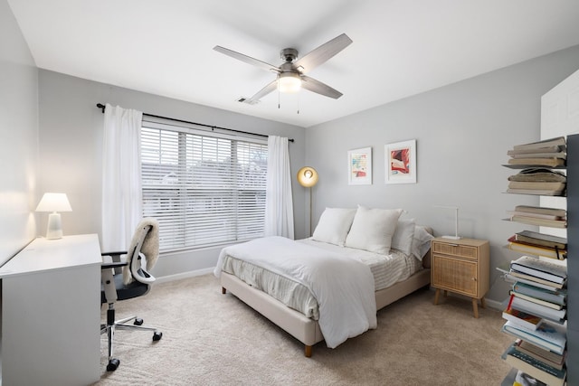 bedroom featuring ceiling fan and light colored carpet