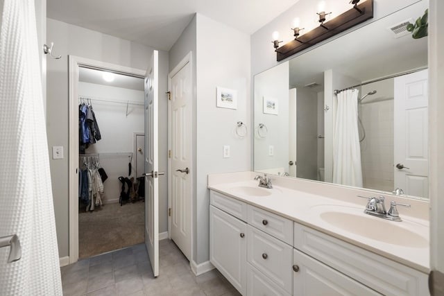 bathroom with vanity and walk in shower