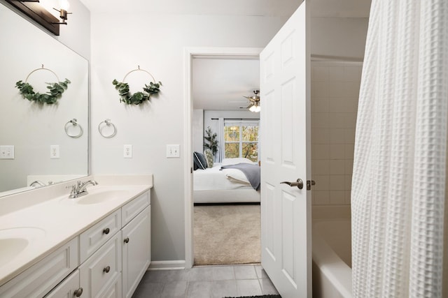 bathroom featuring ceiling fan, tile patterned flooring, vanity, and shower / tub combo