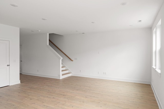 empty room featuring light hardwood / wood-style floors and plenty of natural light