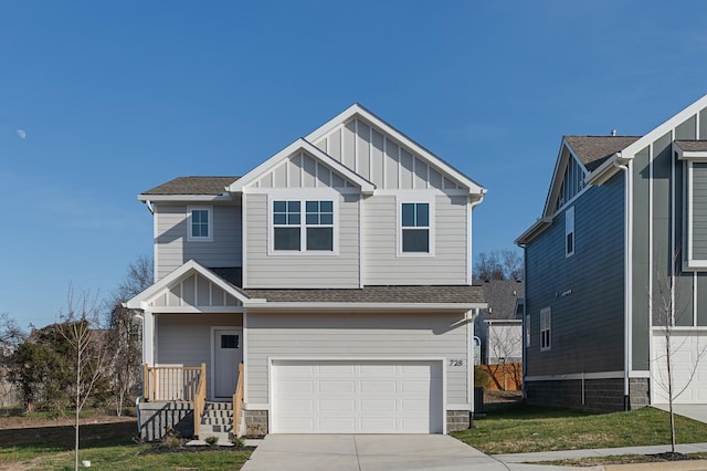 craftsman inspired home featuring a front yard and a garage