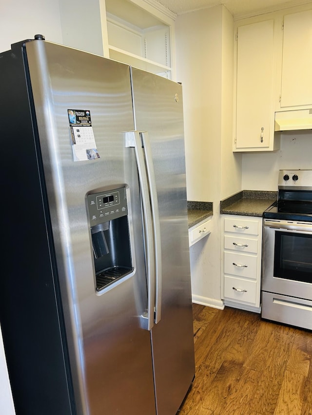 kitchen with white cabinets, appliances with stainless steel finishes, ventilation hood, and dark wood-type flooring