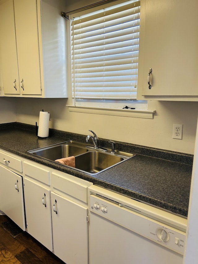 kitchen with dishwasher, white cabinets, dark wood-type flooring, and sink