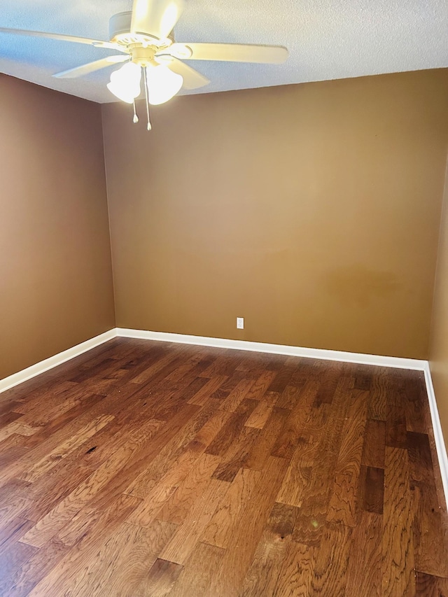 spare room featuring ceiling fan, a textured ceiling, and hardwood / wood-style flooring