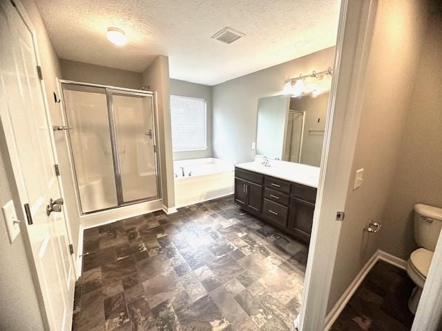 full bathroom with shower with separate bathtub, a textured ceiling, and toilet