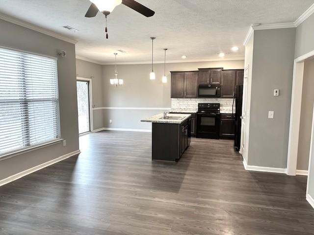 kitchen with dark brown cabinetry, tasteful backsplash, decorative light fixtures, black appliances, and ceiling fan with notable chandelier