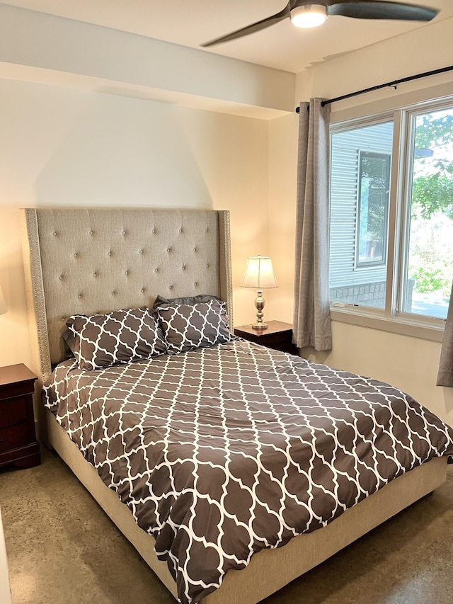 carpeted bedroom featuring ceiling fan