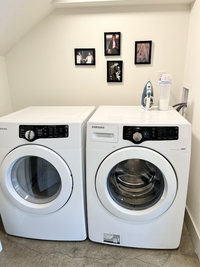 washroom with washer and dryer