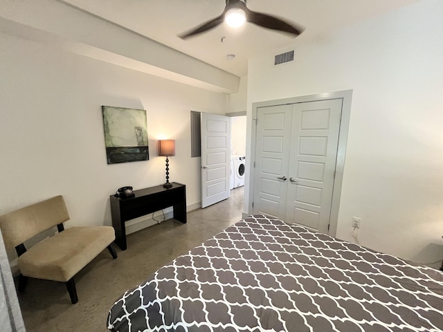 bedroom with washer and dryer, a closet, and ceiling fan