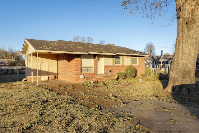 view of front of home featuring a carport