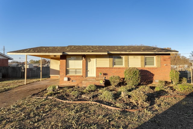 view of front of home featuring a carport