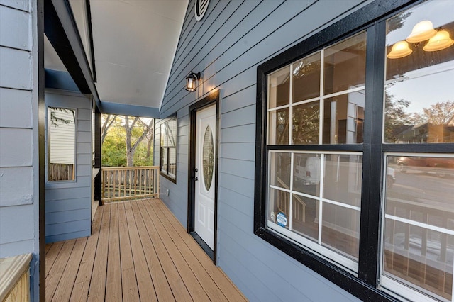 wooden terrace featuring covered porch