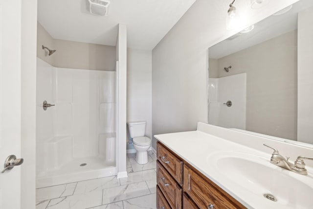 bathroom with vanity, toilet, and walk in shower