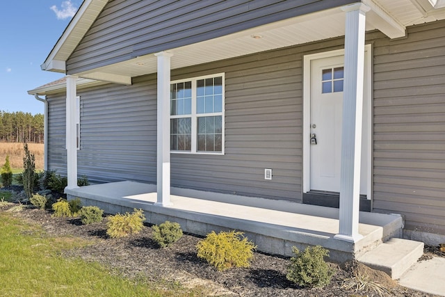 entrance to property featuring a porch