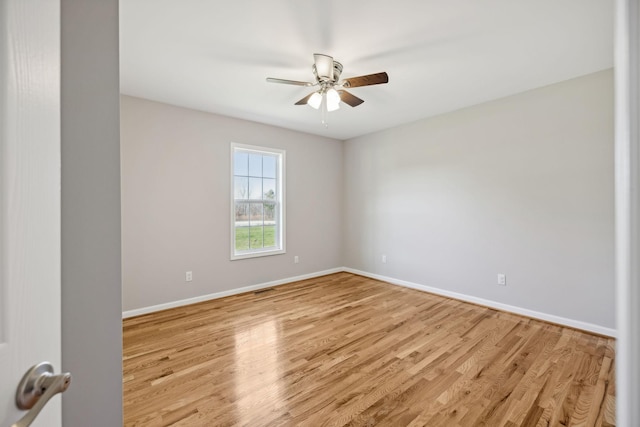 unfurnished room featuring ceiling fan and light wood-type flooring