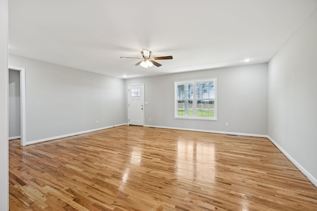 unfurnished room featuring ceiling fan and light wood-type flooring