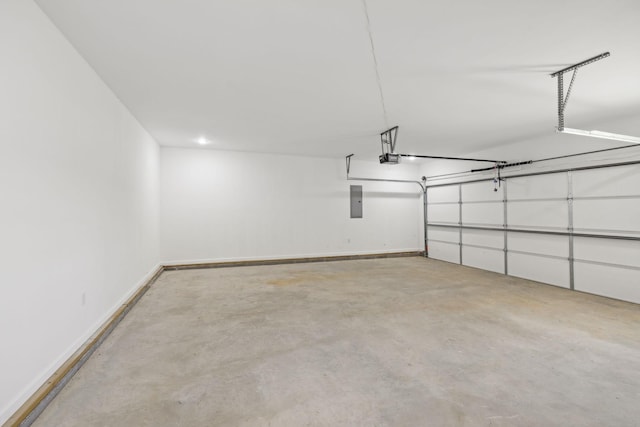 garage with electric panel and a garage door opener