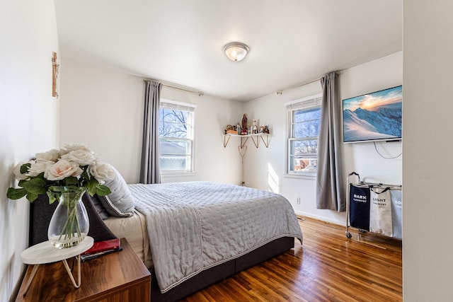 bedroom with hardwood / wood-style flooring