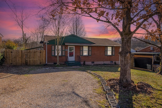 single story home featuring a lawn