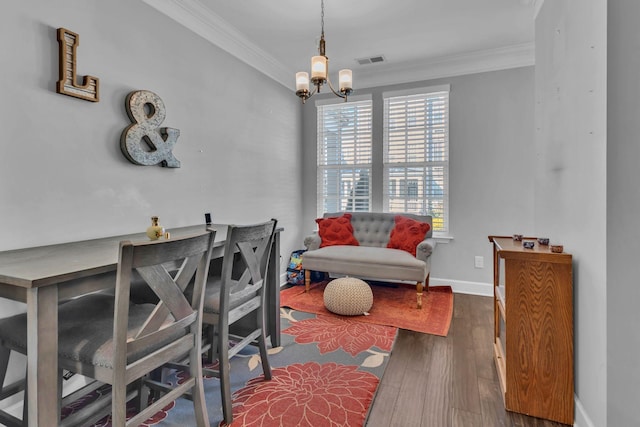 dining area featuring a notable chandelier, dark hardwood / wood-style floors, and ornamental molding