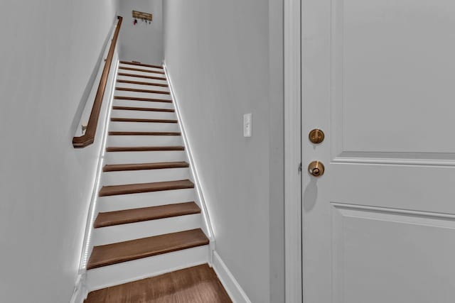 stairs with wood-type flooring