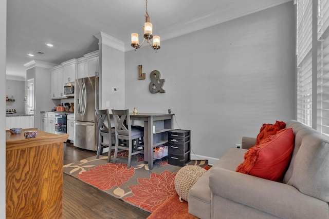 living room with a chandelier, ornamental molding, and dark wood-type flooring