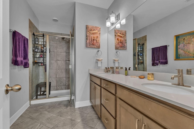 bathroom featuring tile patterned flooring, vanity, and an enclosed shower