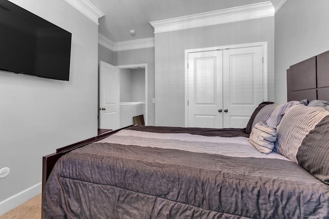 bedroom featuring light carpet, a closet, and ornamental molding