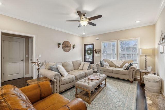 living room with dark hardwood / wood-style floors, ceiling fan, and ornamental molding