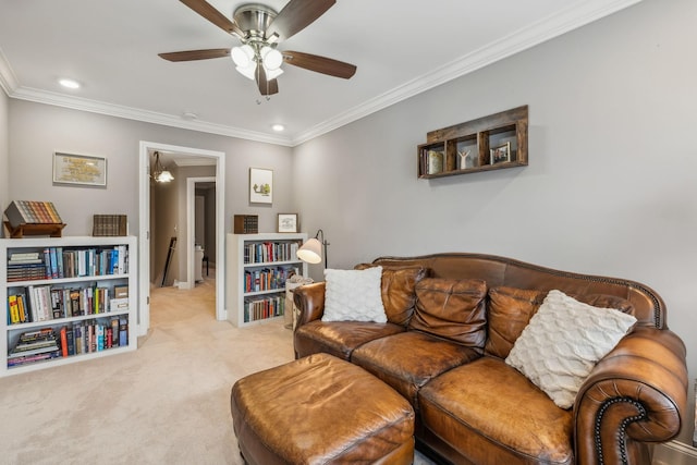 living room featuring ceiling fan, light colored carpet, and ornamental molding