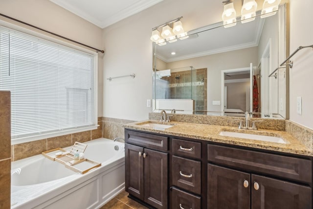 bathroom with tile patterned floors, vanity, separate shower and tub, and crown molding