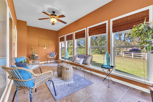 sunroom / solarium featuring ceiling fan