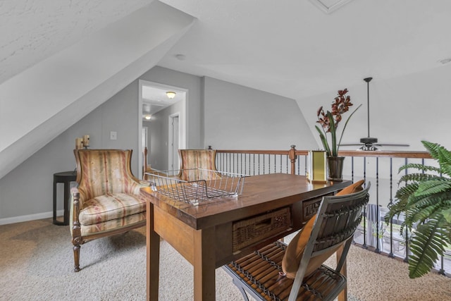 living area with ceiling fan, carpet floors, and vaulted ceiling