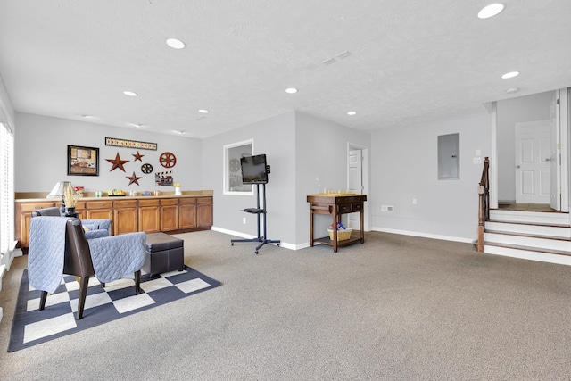 interior space featuring a textured ceiling and electric panel