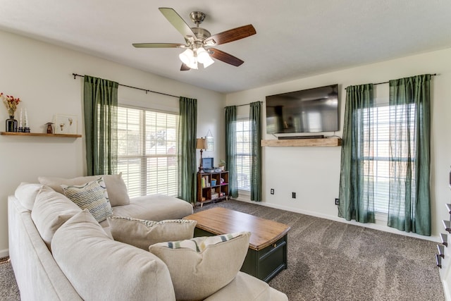 carpeted living room with ceiling fan