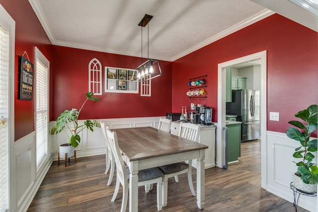 dining area featuring crown molding and dark hardwood / wood-style floors