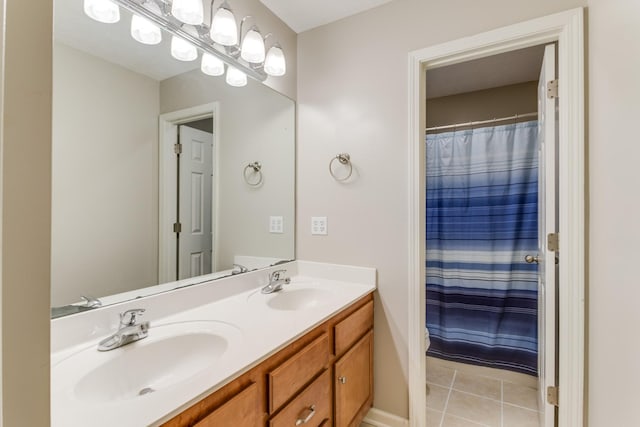 bathroom featuring walk in shower, vanity, and tile patterned flooring