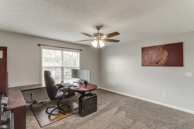 office space featuring ceiling fan, carpet, and a textured ceiling