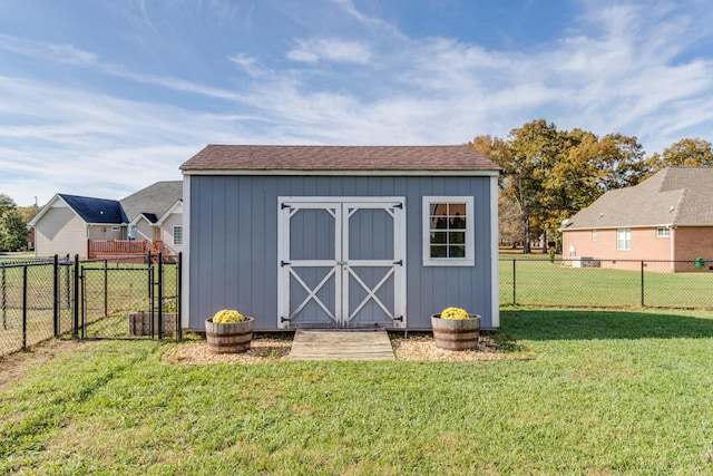 view of outbuilding with a lawn