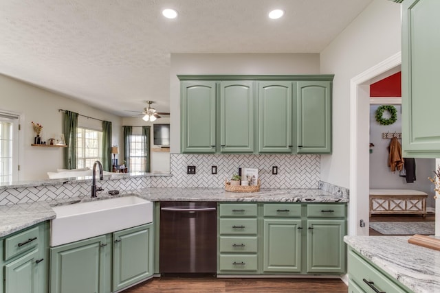 kitchen featuring sink, stainless steel dishwasher, ceiling fan, and green cabinets