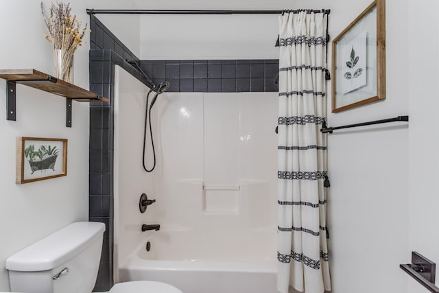 bathroom featuring shower / bathtub combination with curtain and toilet