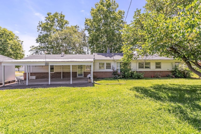 back of house with a yard