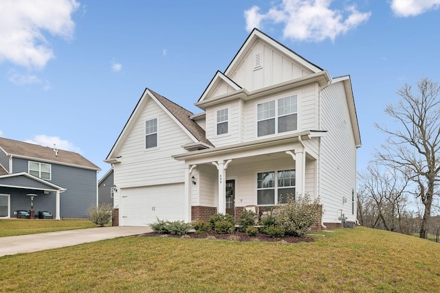 craftsman inspired home featuring a garage and a front lawn