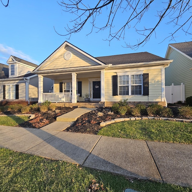 ranch-style home featuring a porch