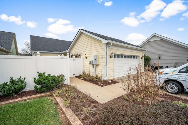 view of property exterior with a garage