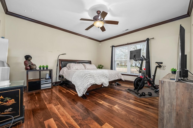 bedroom with dark hardwood / wood-style floors, ceiling fan, and crown molding