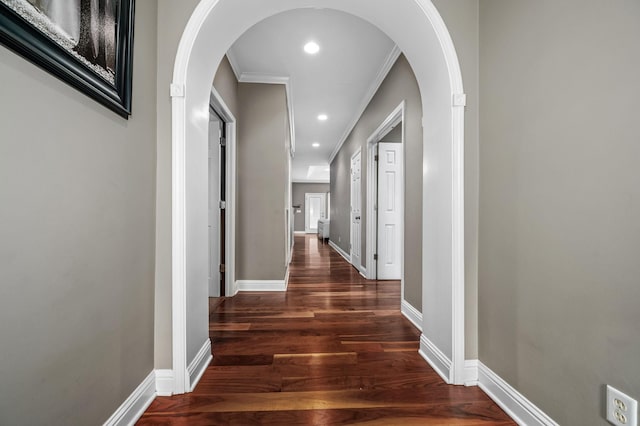 hall featuring dark hardwood / wood-style floors and crown molding