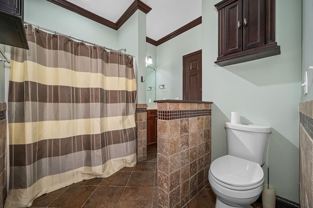 bathroom with toilet, walk in shower, and ornamental molding